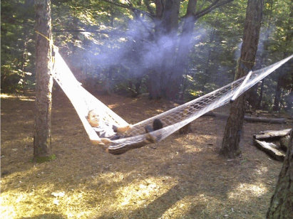 Swinging in a hammock. Summer Fun Without the Bites: How Minus Bite Natural Bug Spray Can Keep Your Family SafeSummer Fun Without the Bites: How Minus Bite Natural Bug Spray Can Keep Your Family Safe